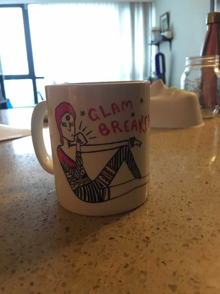Coffee mug with glam-rock illustration