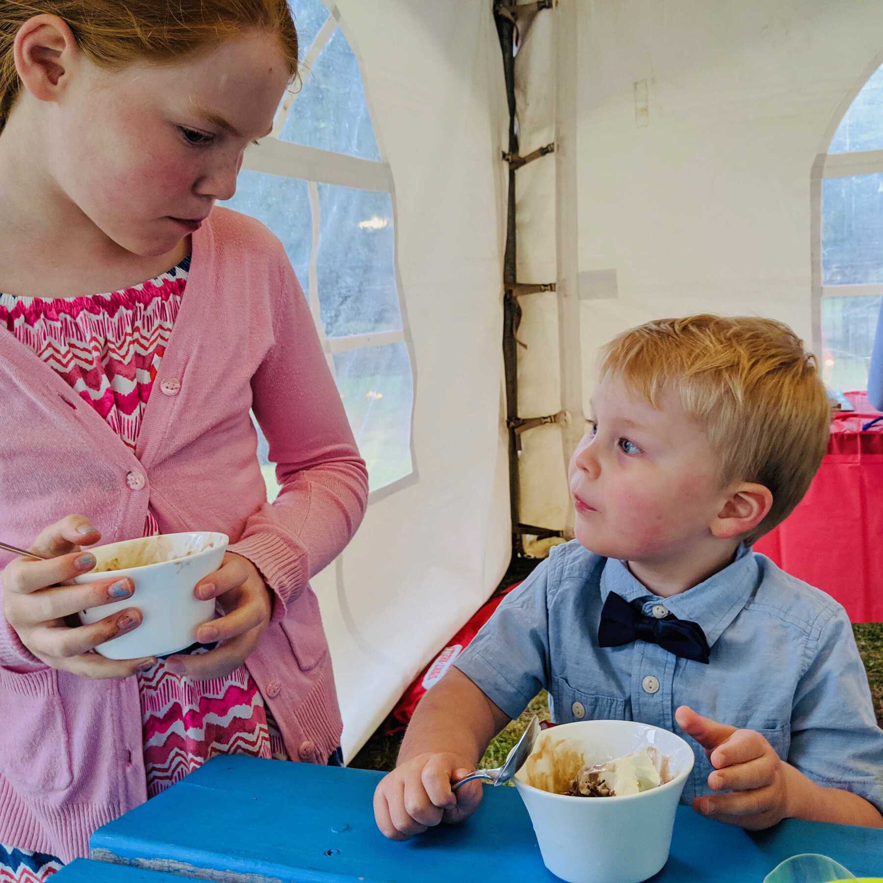Young boy and girl eating ice cream