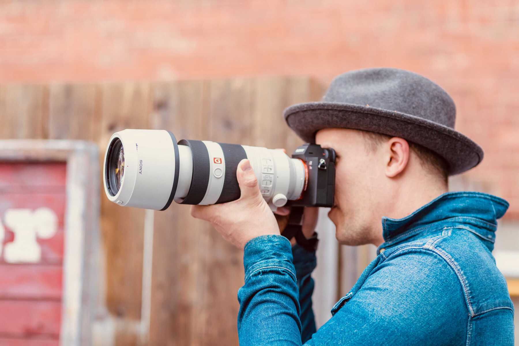 Man taking photo with zoom lens
