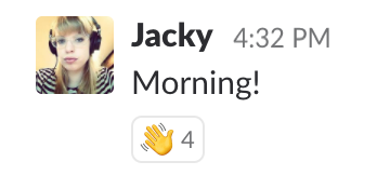 Screenshot of Slack message with wave emoji response