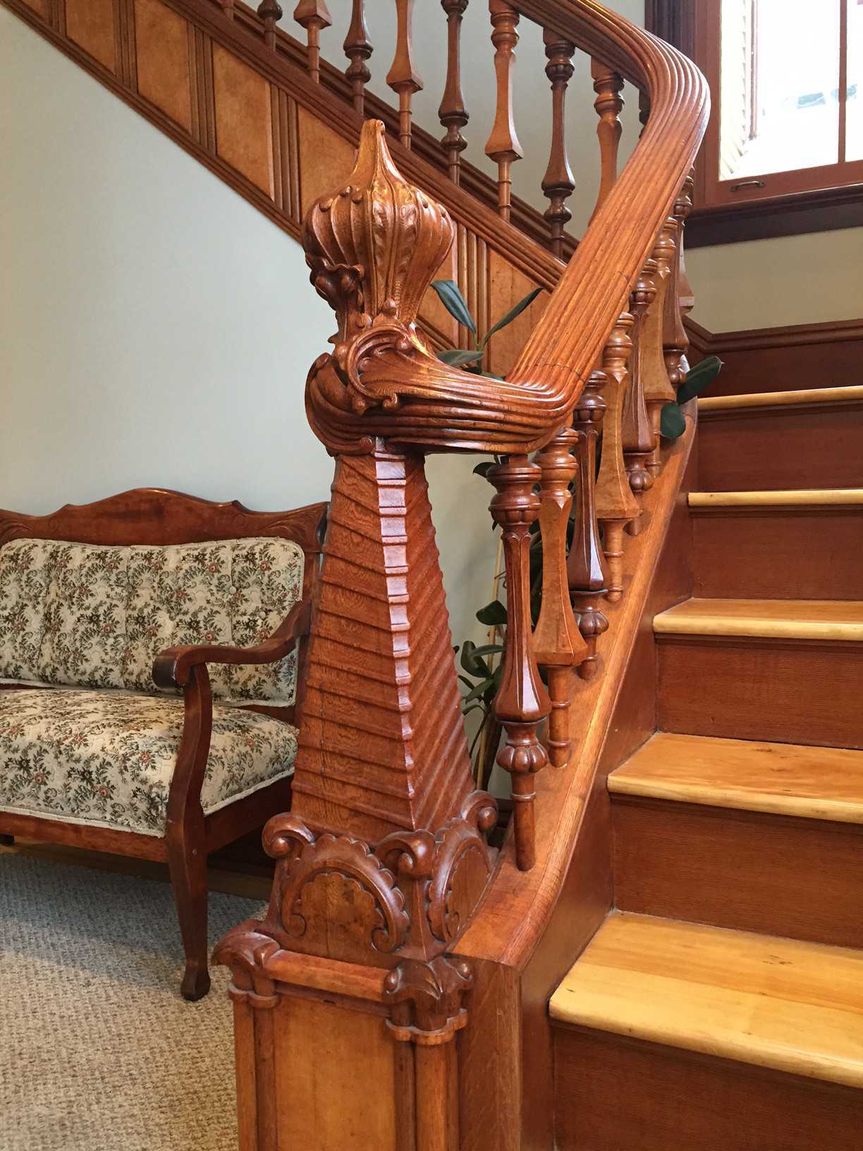 Stairs and railing with elaborate woodwork
