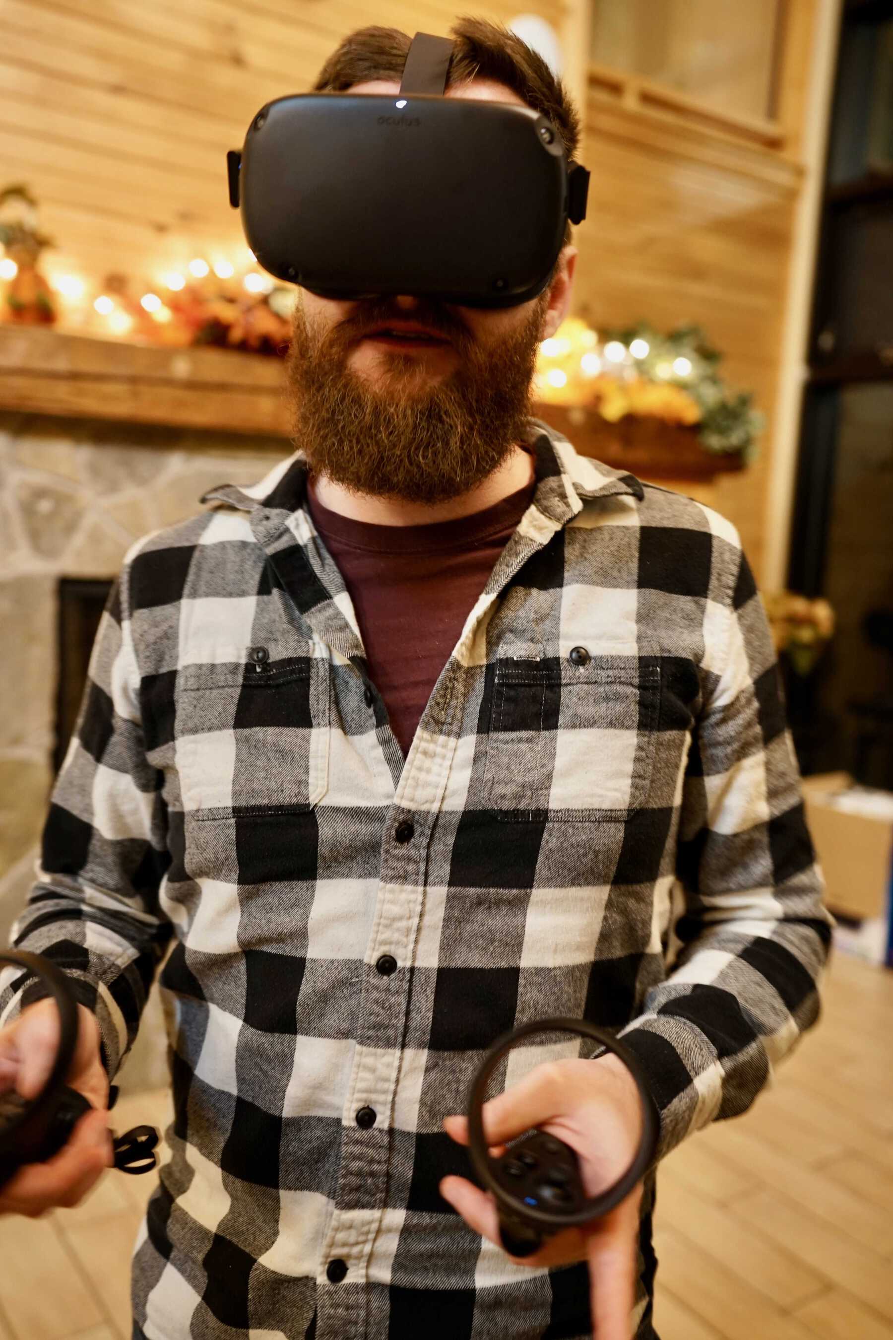 Man in beard wearing virtual reality headset