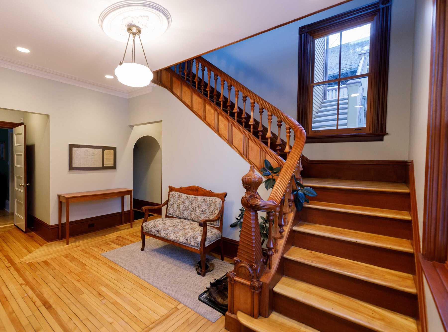 Interior entrance area of office with ornate wooden railing